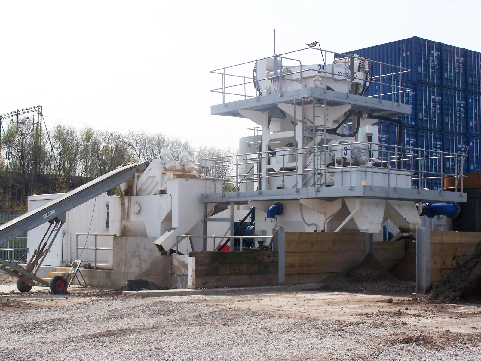 Soil-remediation plant equipment and material-handling conveyor — representative environmental treatment setting